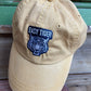 mustard yellow vintage feel hat with indigo blue easy tiger patch