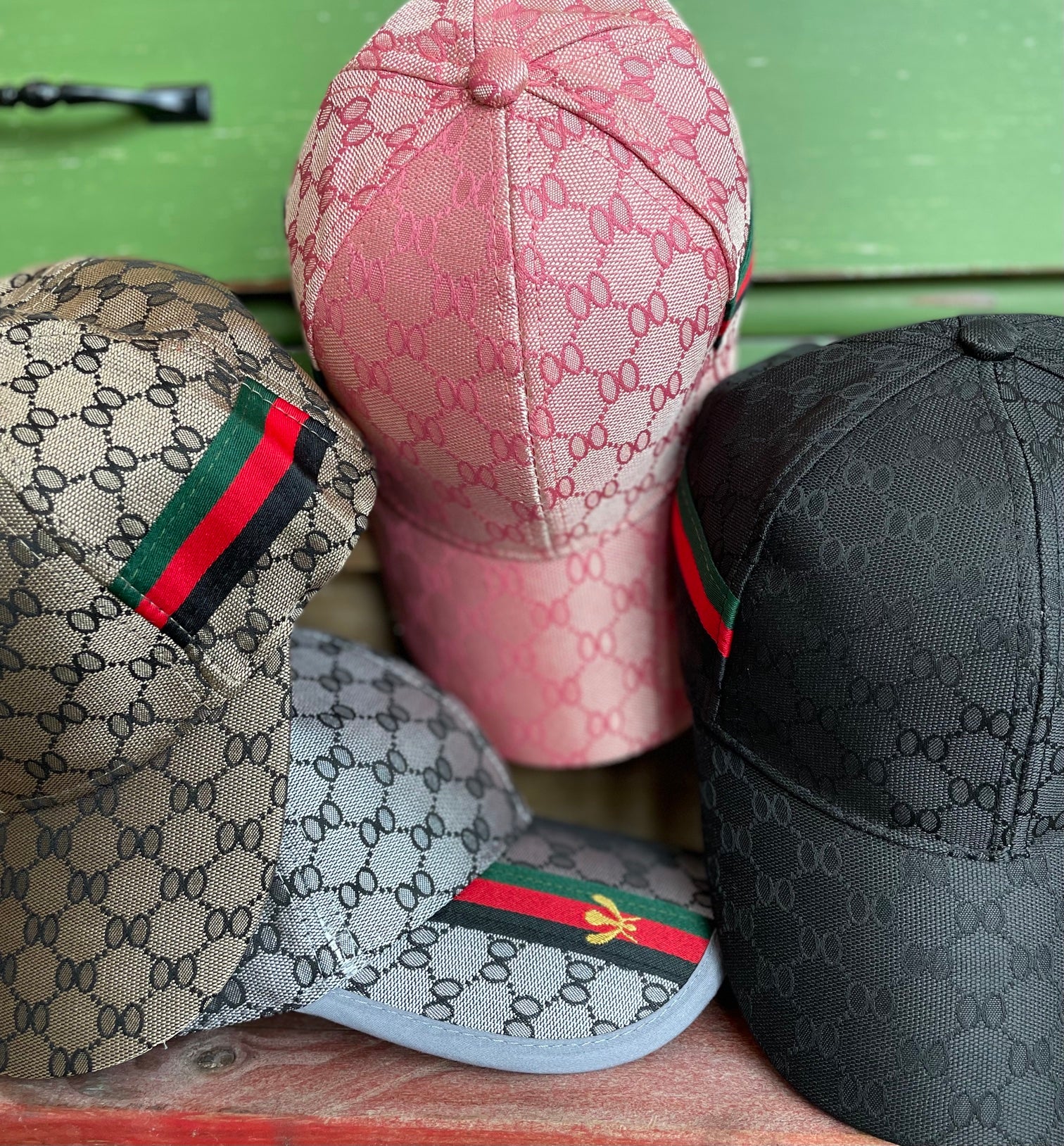 collection of honeycomb print hats in pink, brown, grey and black