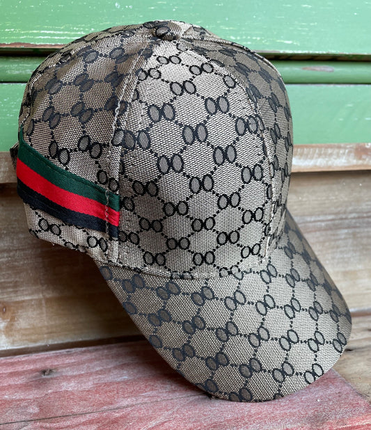 honeycomb print brown hat with green, red and black stripe on side