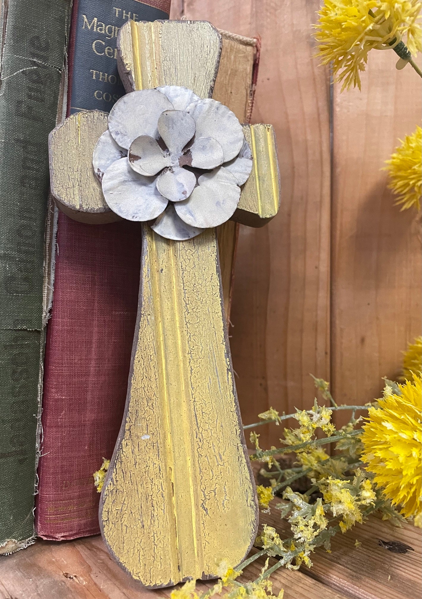 Disstressed Yellow wooden cross with white metal floral accent