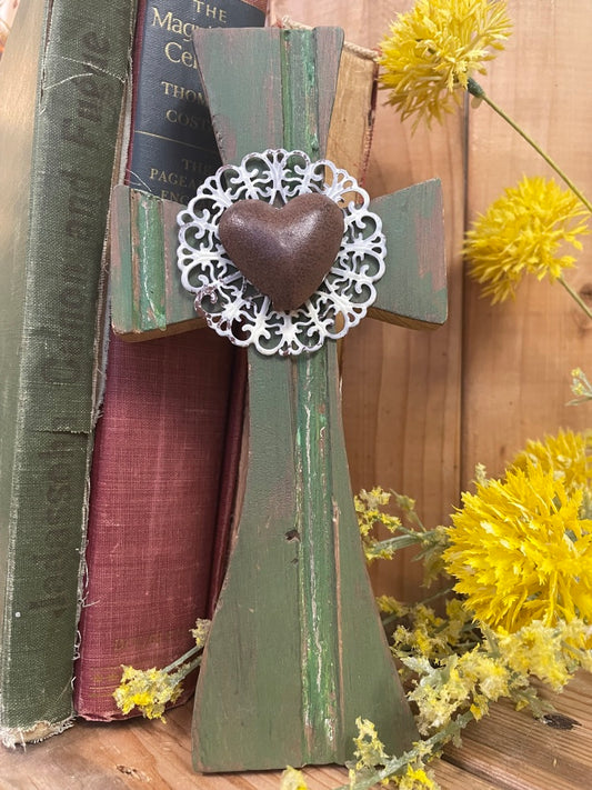 olive green cross with white metal floral accent and copper heart