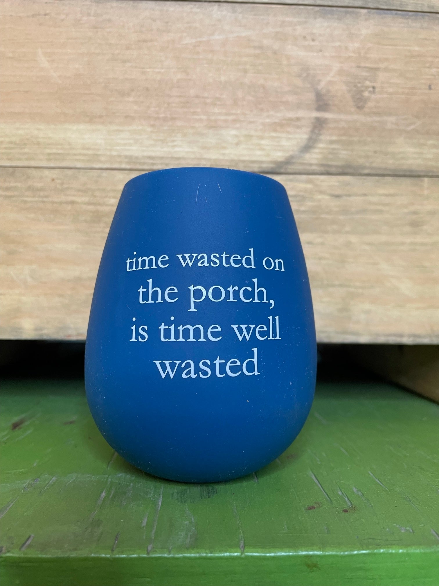 "time wasted on the porch, is time well wasted" blue stemless silicone wine glass